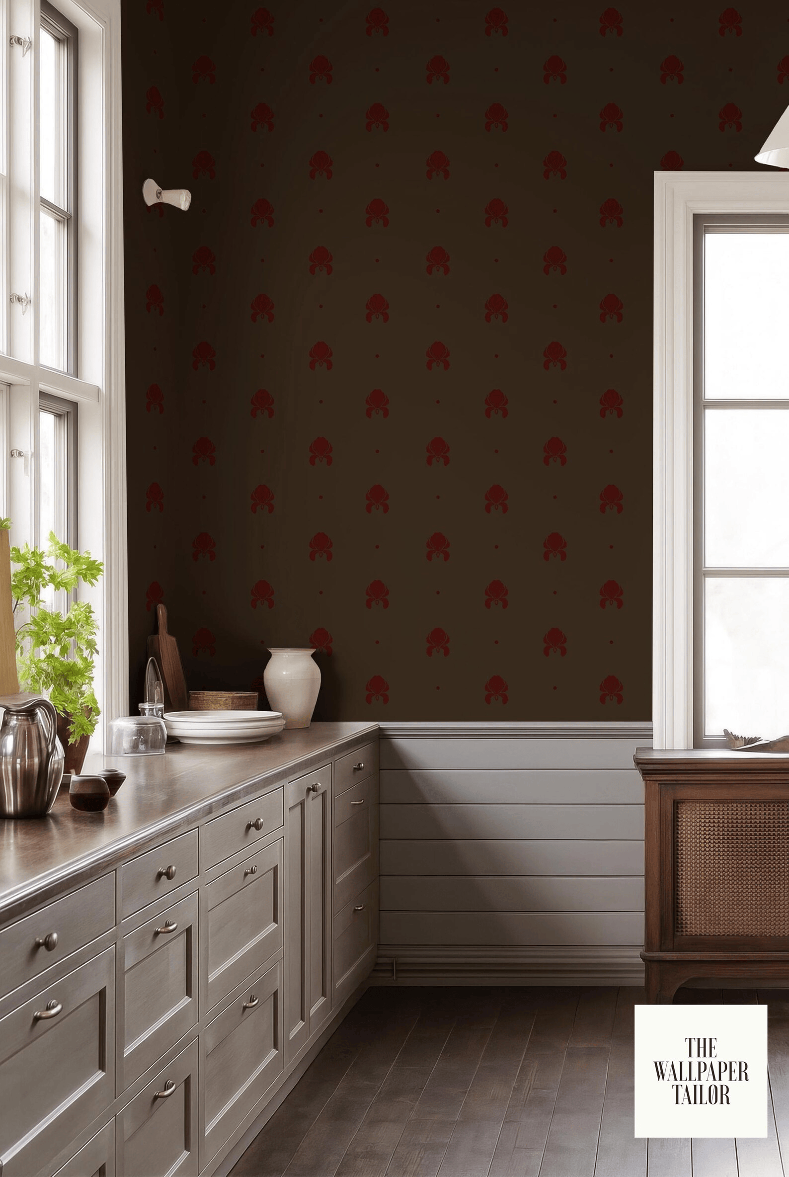 a kitchen with a dark brown wall featuring a repeating pattern of red and white flowers. The kitchen has white cabinets and a wooden countertop, and there is a window above the counter.