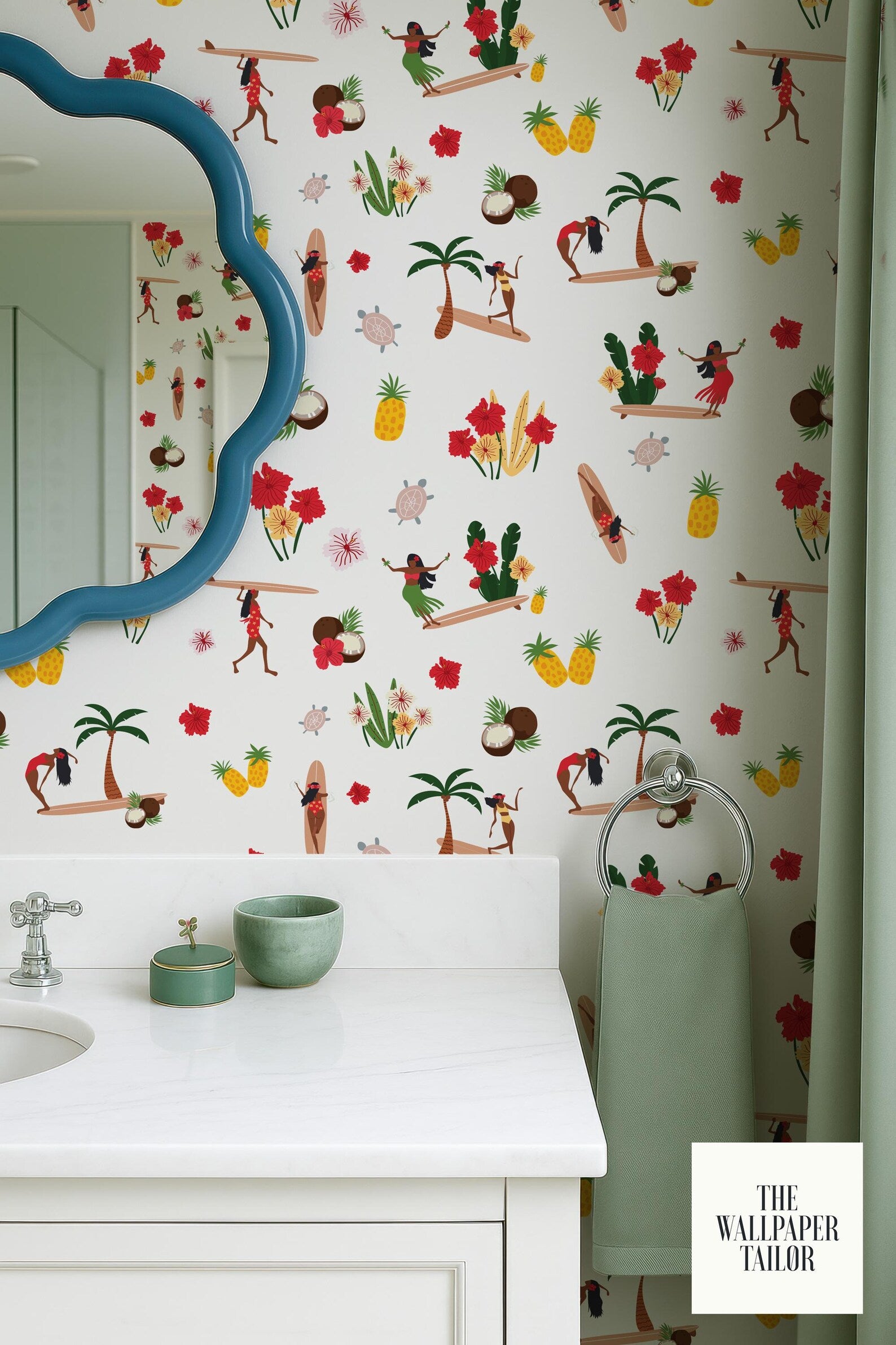 a bathroom with a white sink and a blue scalloped mirror above it. The wall behind the sink is decorated with a colorful, tropical-themed wallpaper. There are also various objects on the counter, including a green bowl and a small green dish.