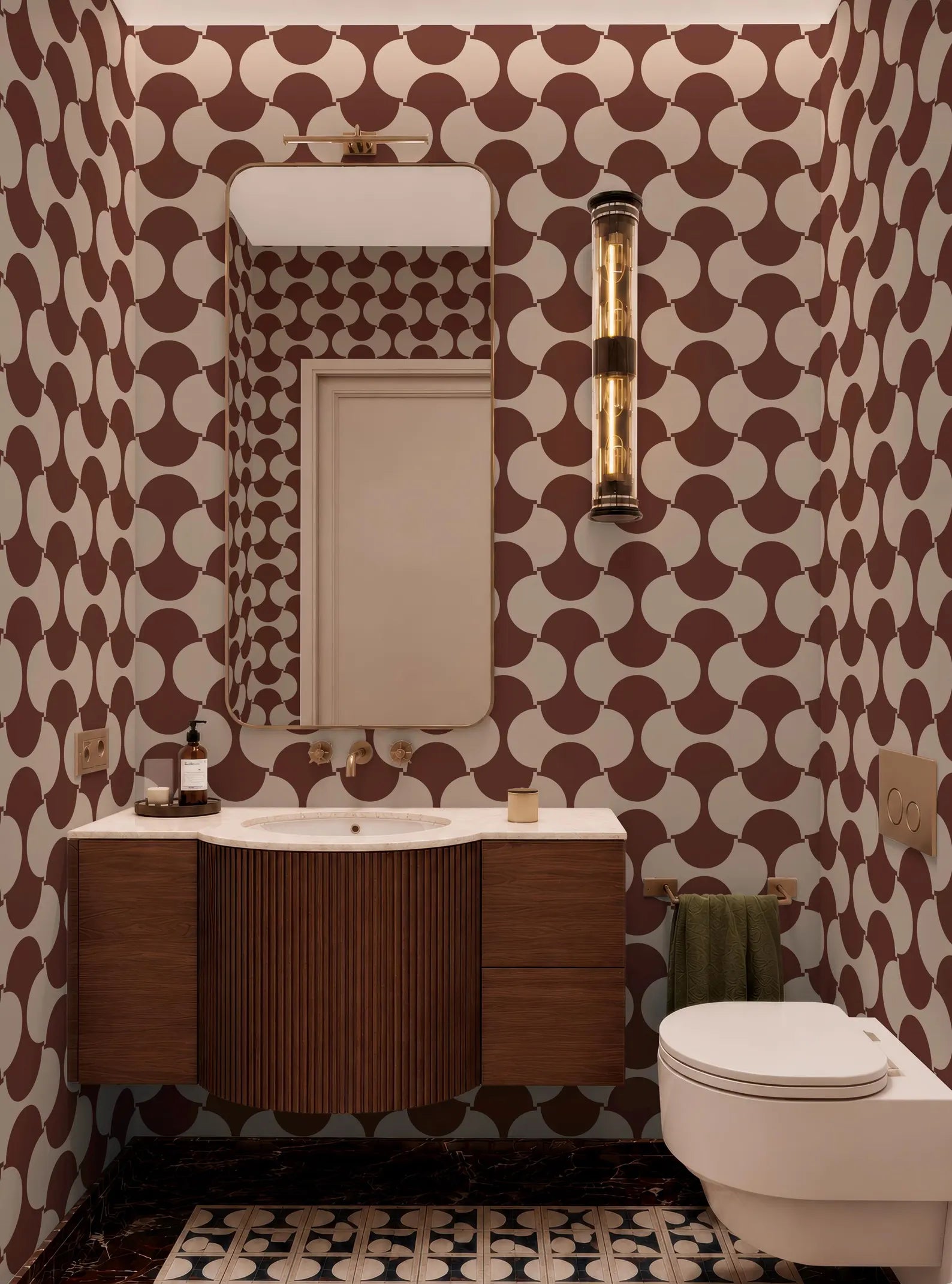 a bathroom with a white sink, a mirror, and a toilet. The walls are covered in a patterned wallpaper with a repeating design of circles and lines in shades of brown and white.
