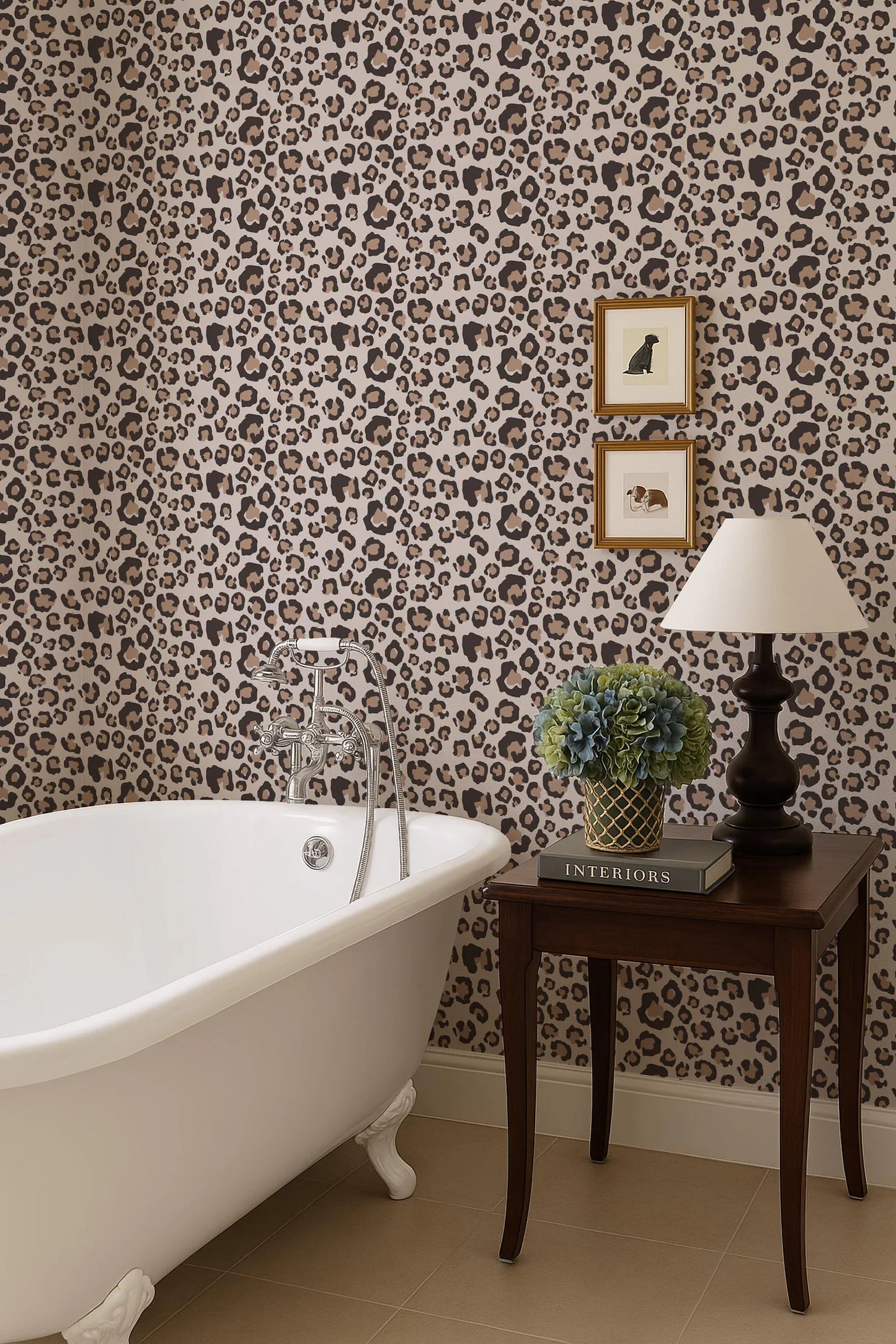 a bathroom with a white clawfoot bathtub, a side table with a lamp and a plant, and a leopard print wallpaper.
