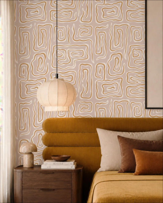 a cozy bedroom with a yellow headboard, a wooden nightstand, and a hanging lamp. The walls are covered in a patterned wallpaper, and the room has a warm, inviting atmosphere.