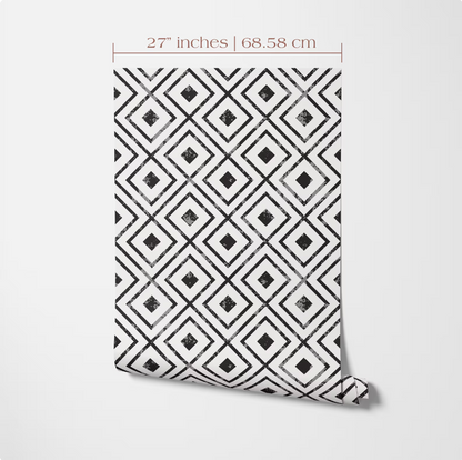 a patterned wallpaper or fabric with a repeating diamond-shaped design in black and white.