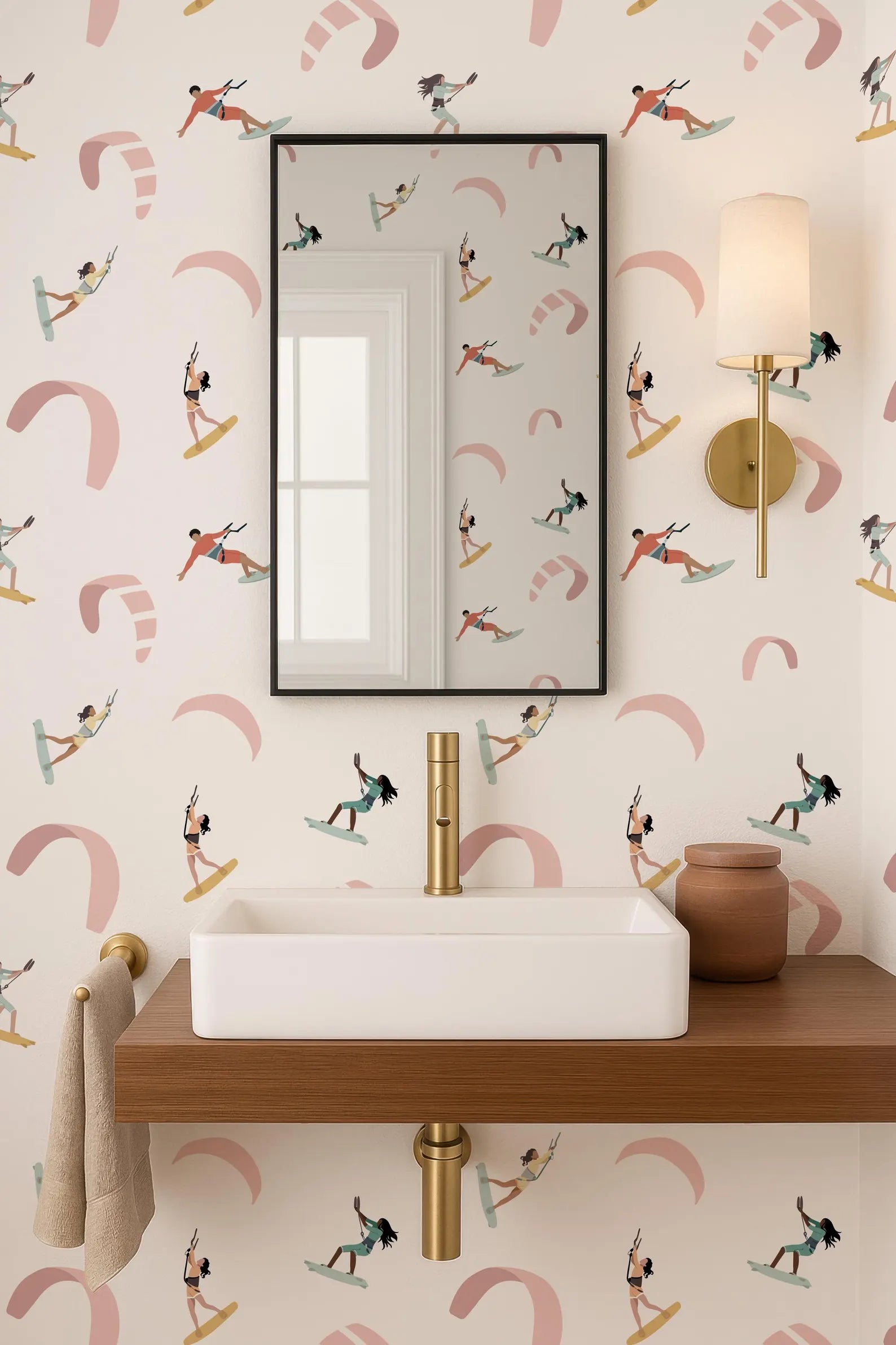 a bathroom with a white sink, a mirror, and a wallpapered wall with a repeating pattern of surfers riding waves.