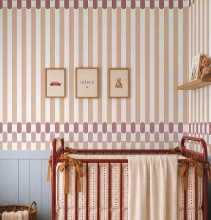 a nursery room with a red metal crib, a wooden shelf with a stuffed animal, and three framed pictures on the wall.