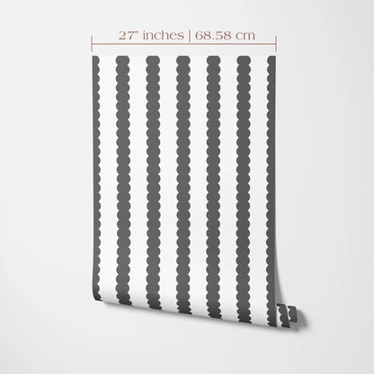 a black and white striped pattern on a wall, with the pattern appearing to be a wallpaper design.