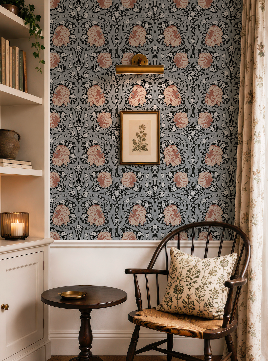 a cozy corner of a room with a wooden chair, a small round table, and a framed print on the wall. The wall has a floral pattern and a light fixture above it.