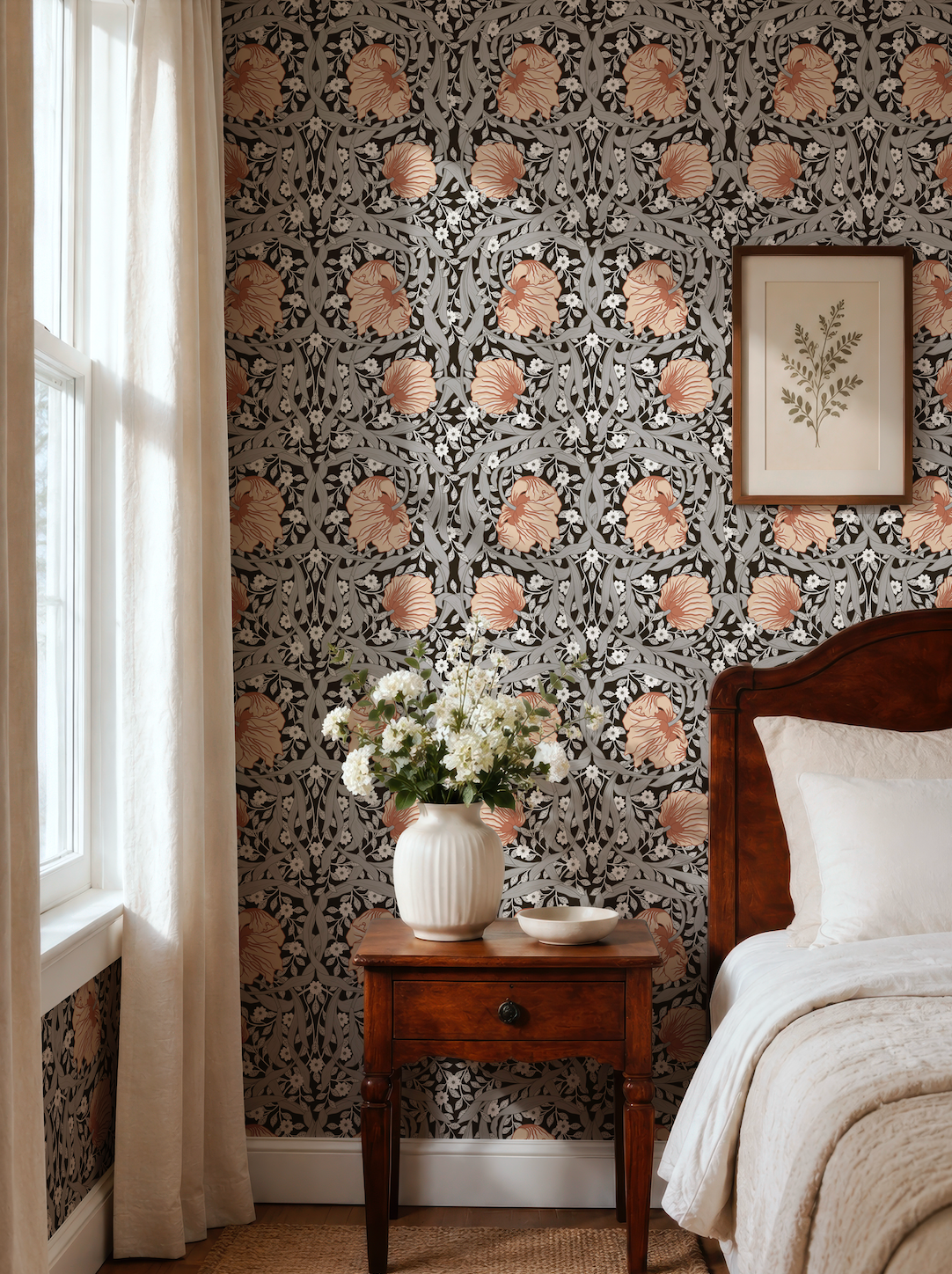 a bedroom with a floral wallpaper, a wooden bed frame, and a wooden nightstand with a vase of white flowers.