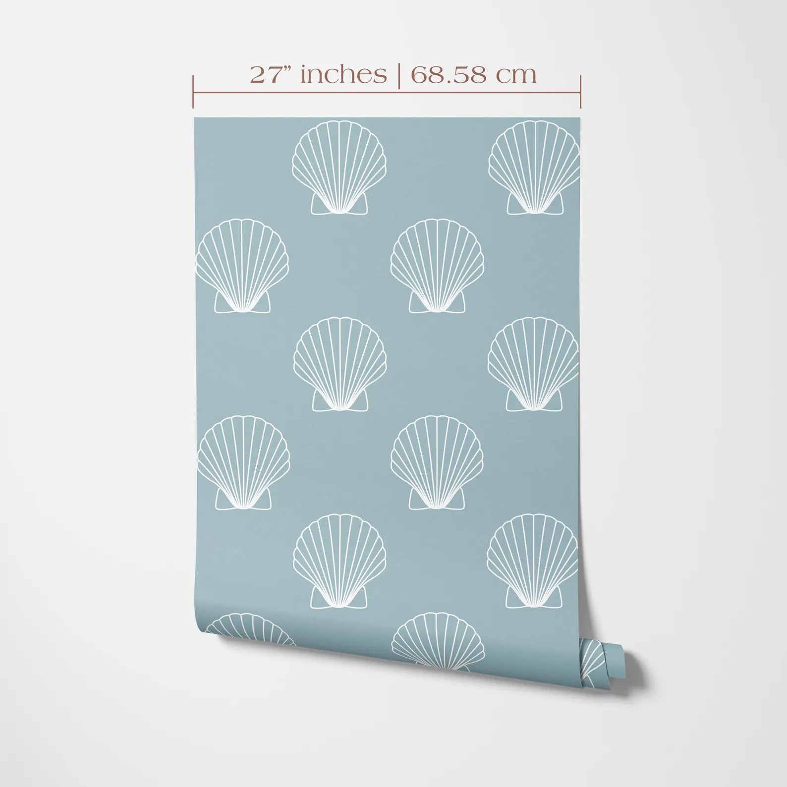 a light blue wall with a repeating pattern of white seashells or clams. The seashells are arranged in a grid-like pattern, creating a visually appealing design. The wall is described as having a size of 27 inches by 68.58 centimeters, indicating the dimensions of the wall.