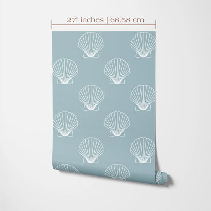 a light blue wall with a repeating pattern of white seashells or clams. The seashells are arranged in a grid-like pattern, creating a visually appealing design. The wall is described as having a size of 27 inches by 68.58 centimeters, indicating the dimensions of the wall.