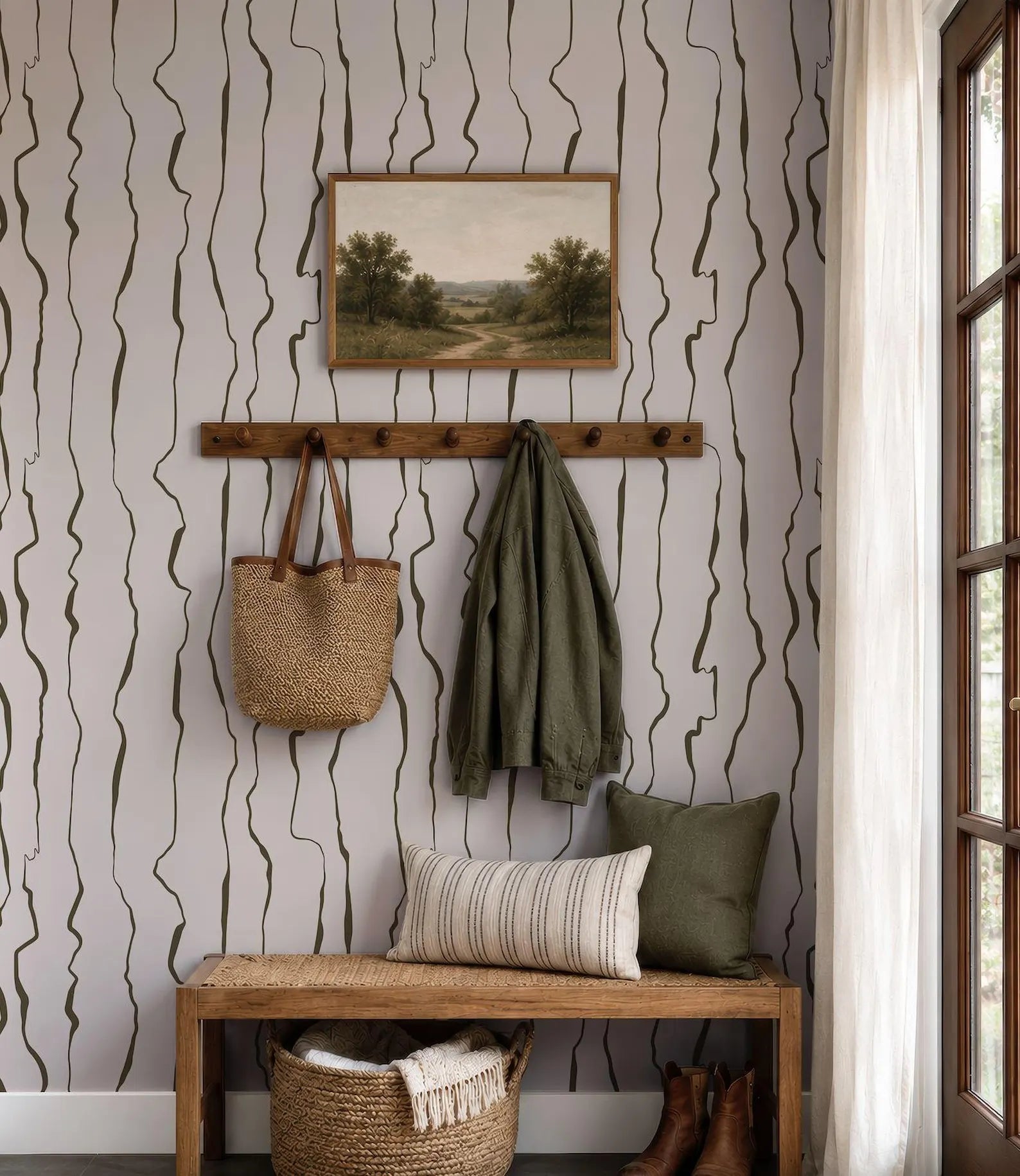 a wooden bench with a woven basket underneath, a coat rack with a jacket hanging on it, a painting on the wall, and a window with a curtain.