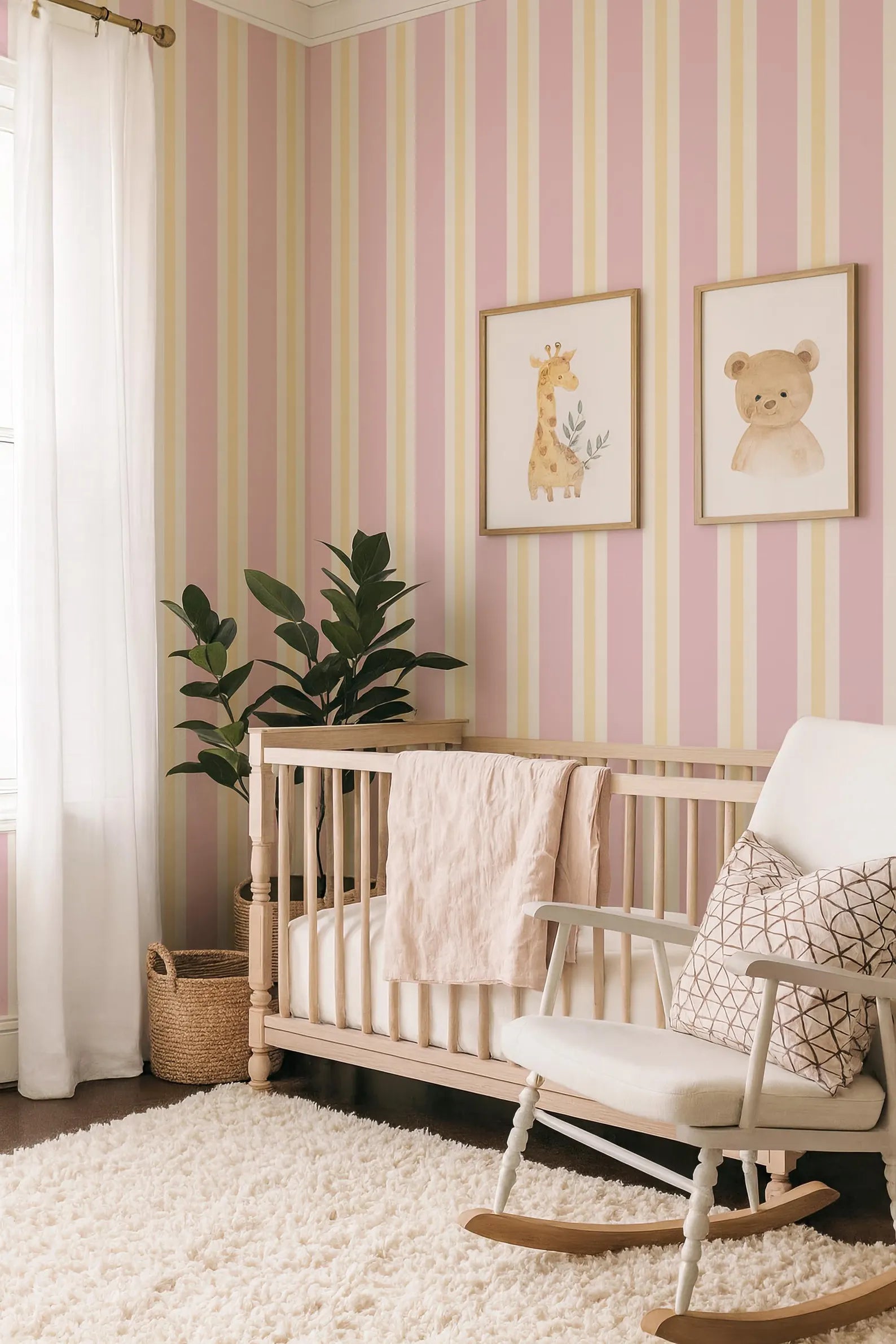 a cozy nursery with a wooden crib, a white rocking chair, and a pink and yellow striped wallpaper. There is a potted plant and a basket in the room, adding to the warm and inviting atmosphere.