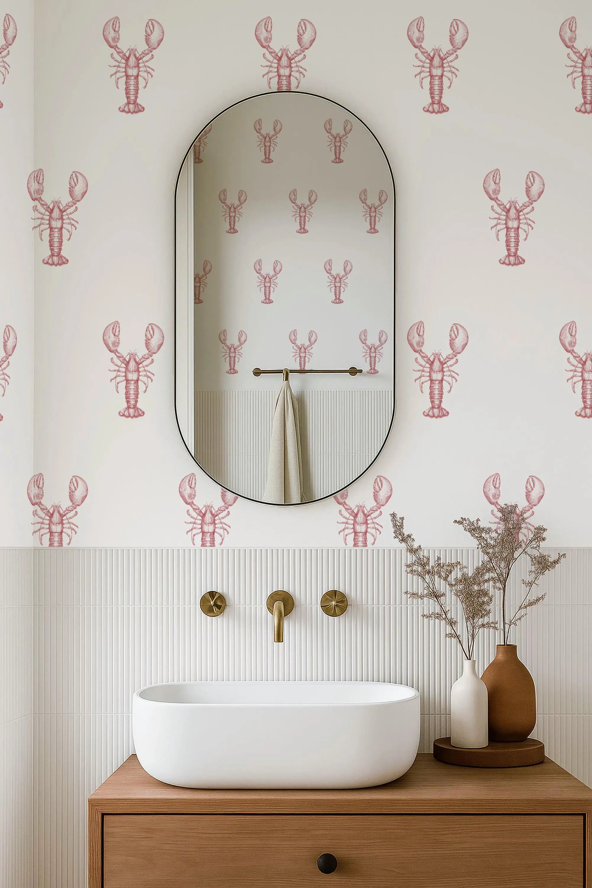 a bathroom with a white sink, a mirror, and a wallpapered wall with a repeating pattern of red lobster illustrations.