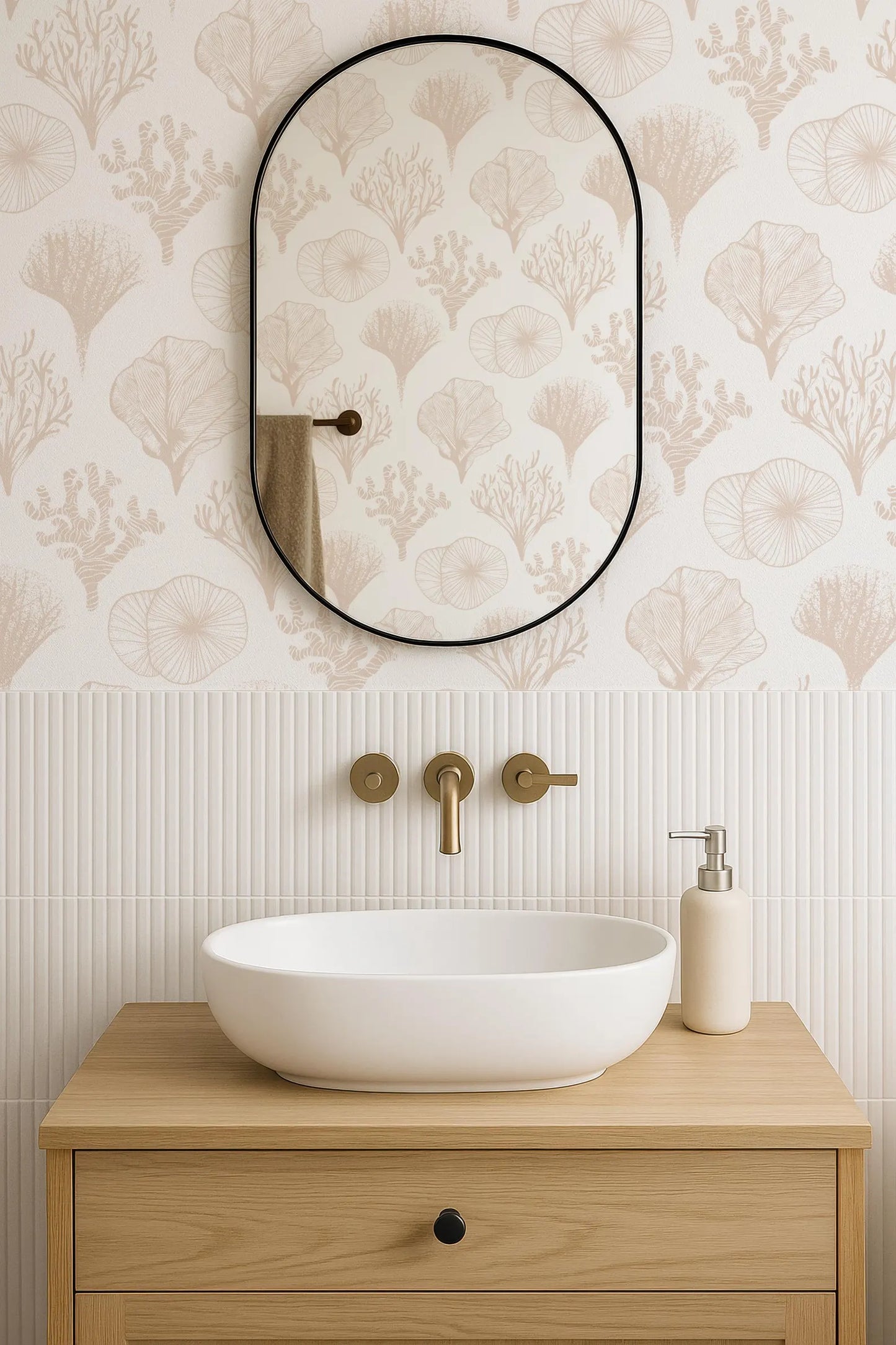a bathroom with a white sink, a mirror, and a wooden cabinet. The wall behind the sink has a patterned wallpaper with a repeating design of leaves and flowers.