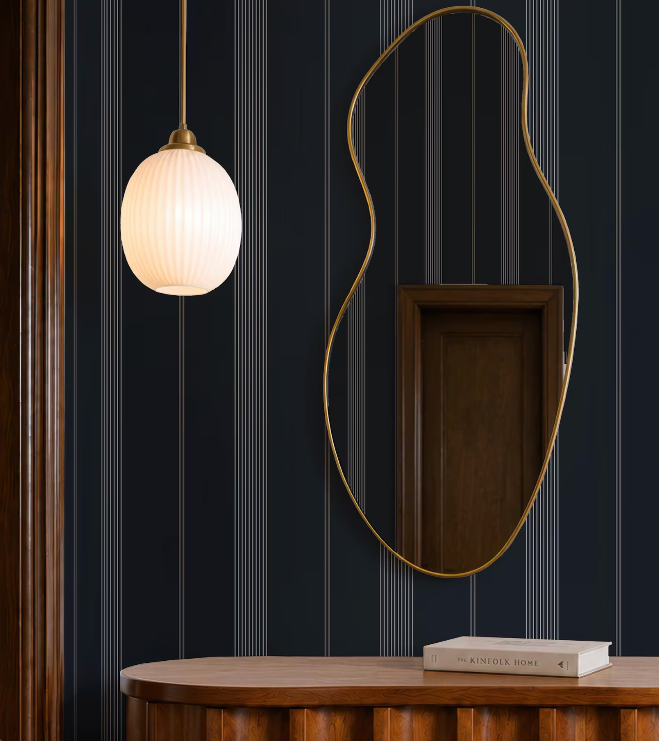 a modern interior design with a wooden table, a round light fixture, and a large mirror with a gold frame.