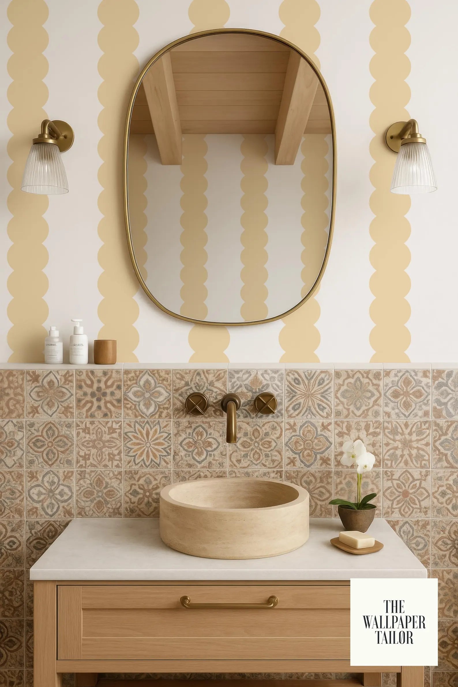 a bathroom with a wooden vanity, a round sink, and a large mirror above it. The walls are adorned with a patterned wallpaper, and there are two wall sconces on either side of the mirror. The bathroom also includes a small potted plant and a soap dish on the vanity.