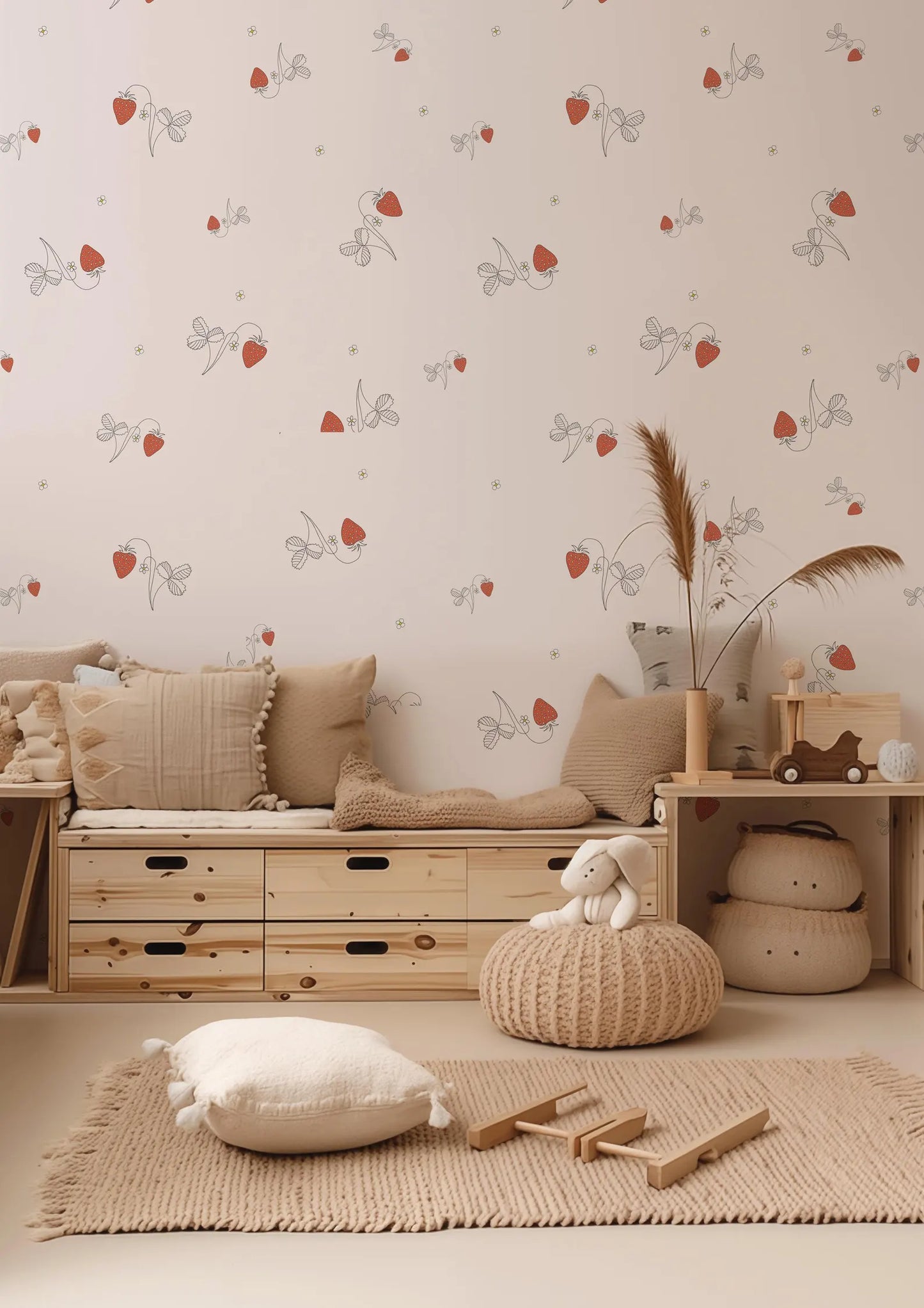 a cozy and inviting nursery or child's room, featuring a wooden bench, a plush chair, and a plush ottoman. The walls are adorned with a pattern of red and white flowers, and the room is decorated with various toys and accents, creating a warm and welcoming atmosphere.