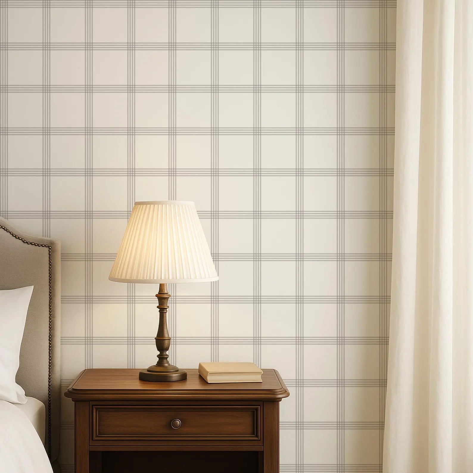 a wooden nightstand with a lamp and a book on top, set against a wall with a checkered pattern.