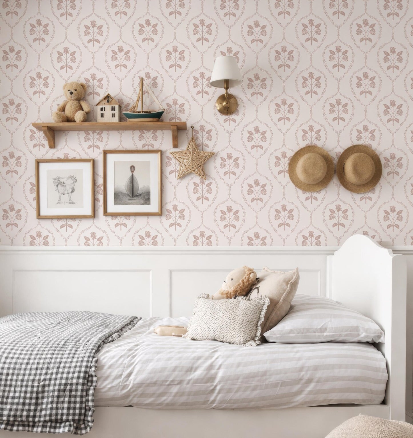 a cozy and charming bedroom with a white bed, a shelf with a teddy bear and a small boat, and a wallpapered wall with a floral pattern.