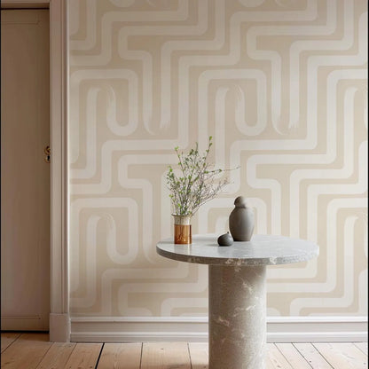 a minimalist interior design with a round table, a vase of flowers, and a gray vase on a white marble table. The wall behind the table has a geometric pattern in a light beige color.