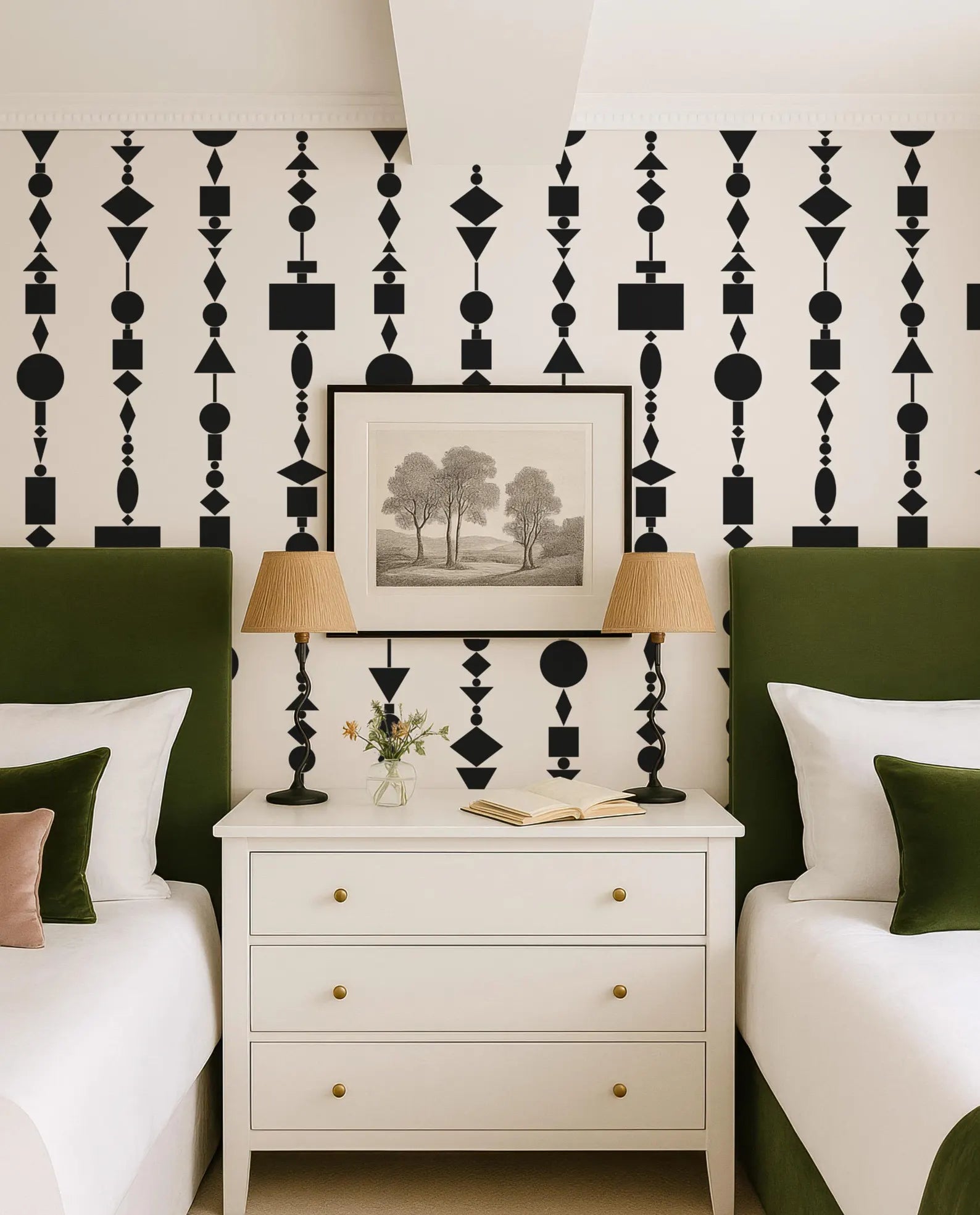 a bedroom with a white dresser, two green headboards, and a framed landscape painting on the wall. The room has a modern and stylish design with a black and white geometric pattern on the wall.