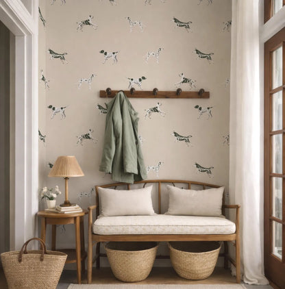 a cozy entryway with a bench, a coat rack, and a lamp. The wall behind the bench is decorated with a pattern of black and white dogs.