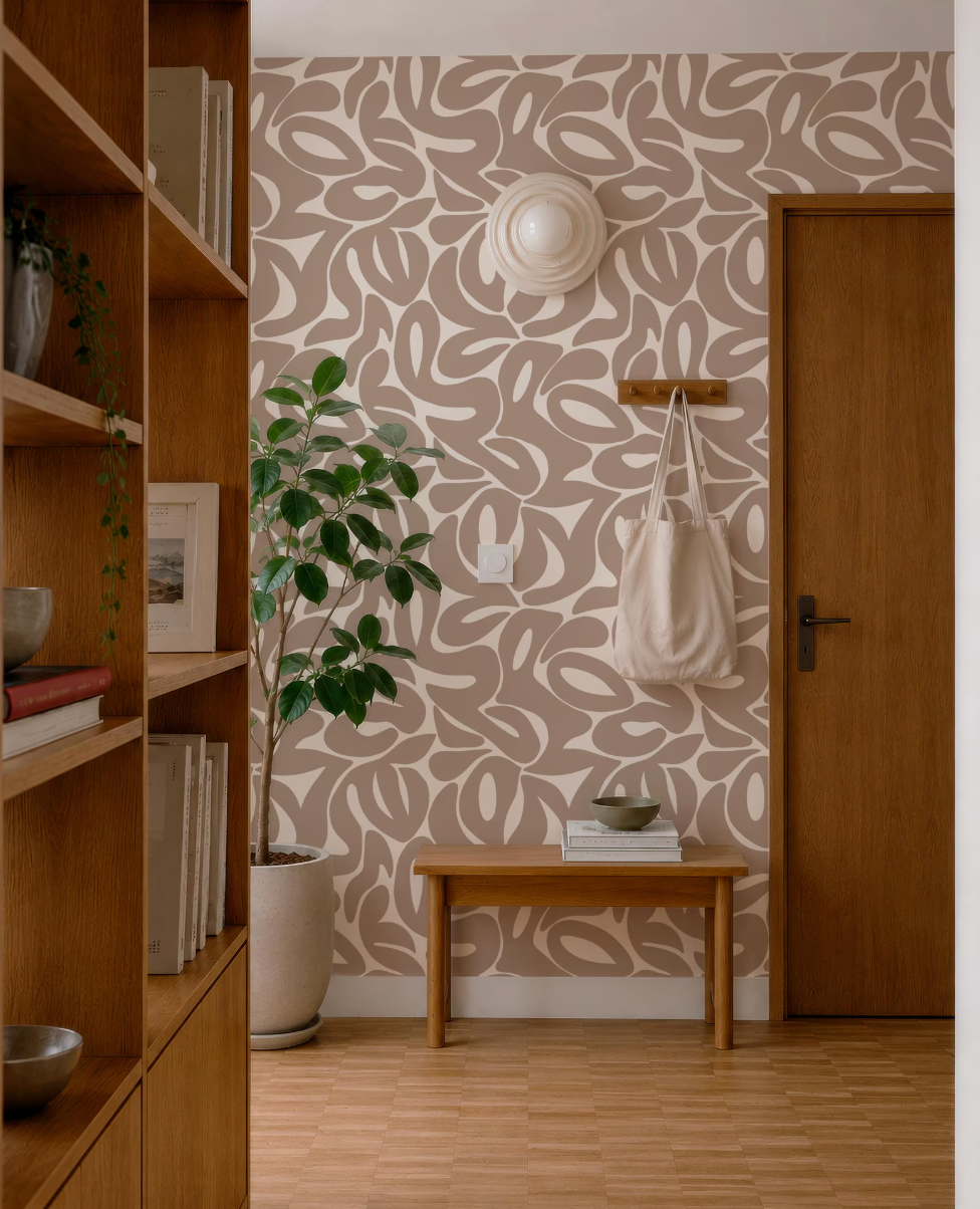 a cozy and well-organized entryway with a wooden bench, a potted plant, and a wooden bookshelf. The walls are adorned with a patterned wallpaper, and a wooden door is visible on the right side of the image.