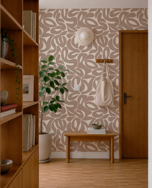 a cozy and well-organized entryway with a wooden bench, a potted plant, and a wooden bookshelf. The walls are adorned with a patterned wallpaper, and a wooden door is visible on the right side of the image.