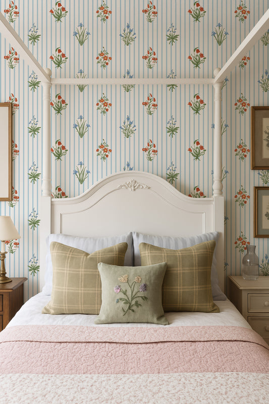 a cozy bedroom with a white canopy bed, a floral wallpaper, and a pink and white bedspread.