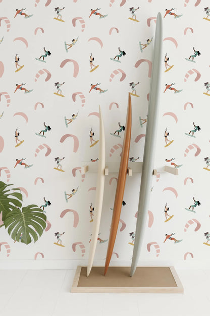 a wall with a repeating pattern of surfers and kites, creating a vibrant and dynamic visual effect.