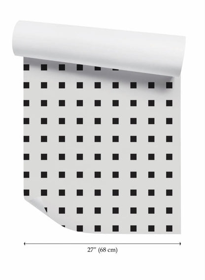 a roll of paper with a repeating pattern of black squares on a white background.