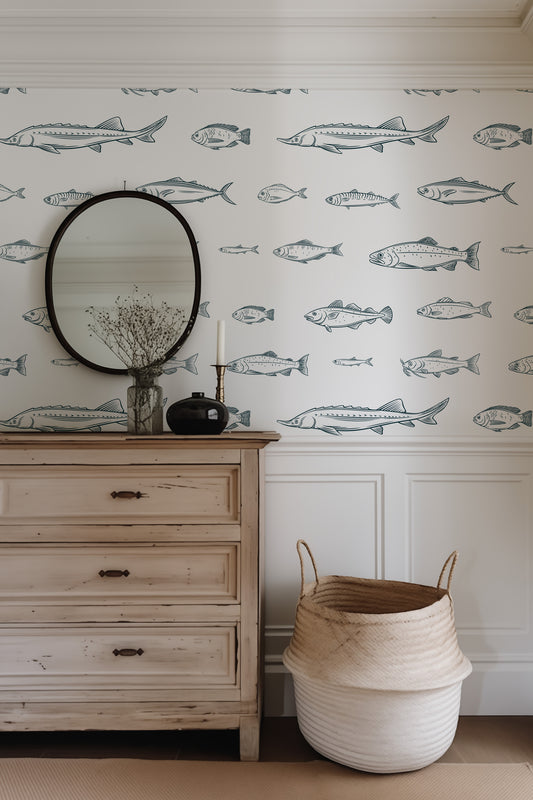 a dresser with a mirror and a fish wallpaper