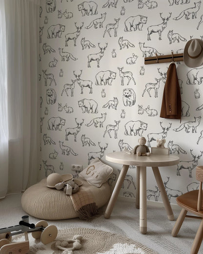 a child's room with a wallpaper with animals on it