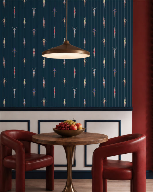 a dining area with a wooden table, two red chairs, and a wall with a pattern of swimming figures. A hanging light fixture is visible above the table.