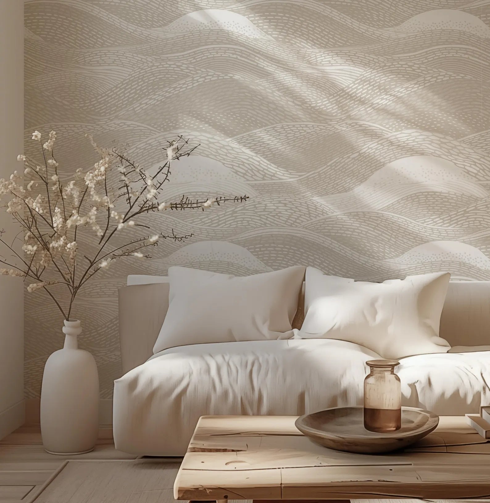 a cozy living room with a white sofa, a wooden coffee table, and a vase of white flowers. The room has a warm, inviting atmosphere with a textured wallpaper and a wooden floor.