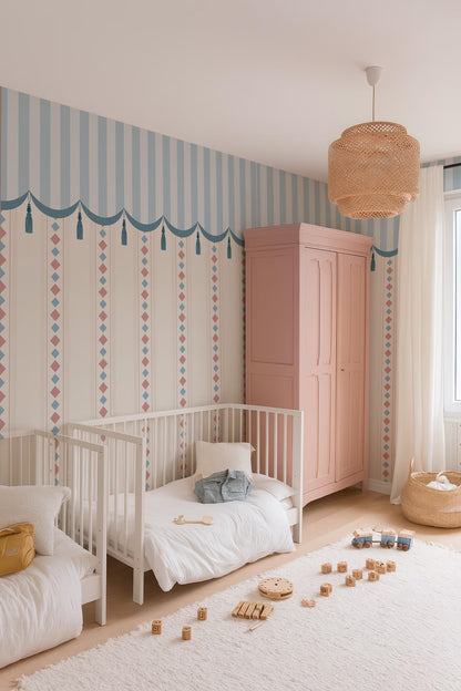 a cozy and colorful nursery room with a white crib, a pink armoire, and a hanging light fixture. The room is decorated with a striped wallpaper and has a rug on the floor. There are several wooden blocks scattered on the floor, suggesting a playful and creative atmosphere.