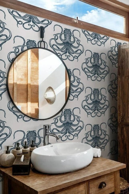 a bathroom with a round mirror, a white sink, and a wall with a repeating pattern of octopus designs.