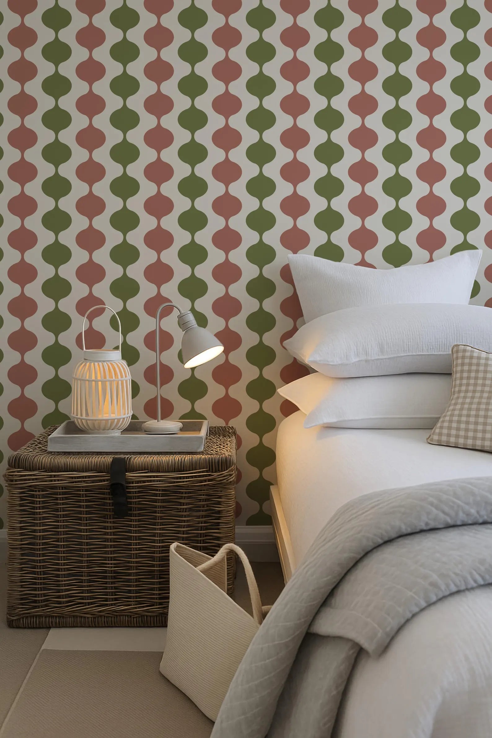 a cozy bedroom scene with a bed, a wicker trunk, and a patterned wallpaper.