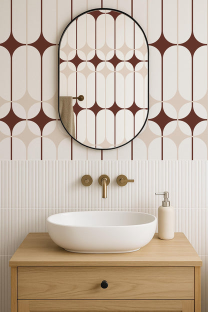 a modern bathroom with a white oval-shaped sink, a wooden cabinet, and a large mirror with a geometric patterned frame.