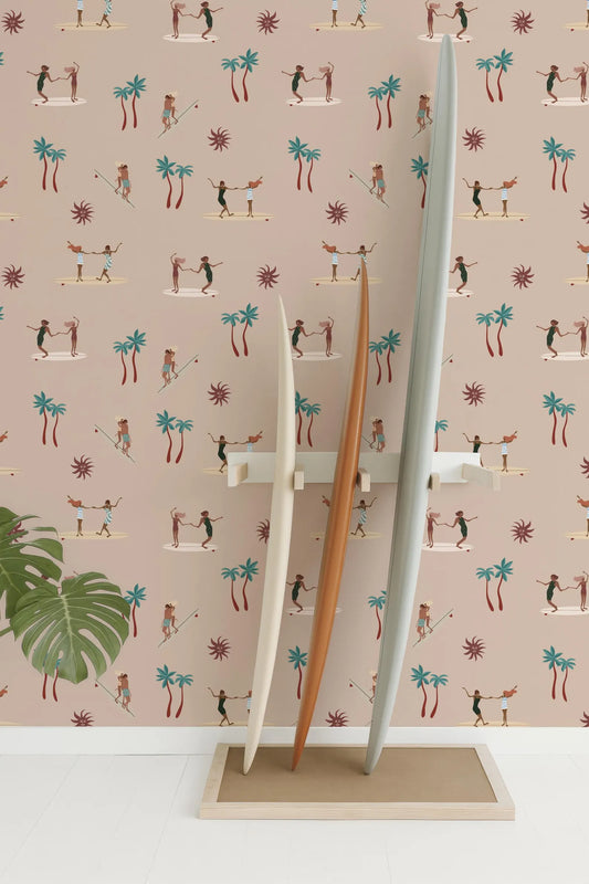 three surfboards standing upright against a wall with a repeating pattern of palm trees and people surfing.
