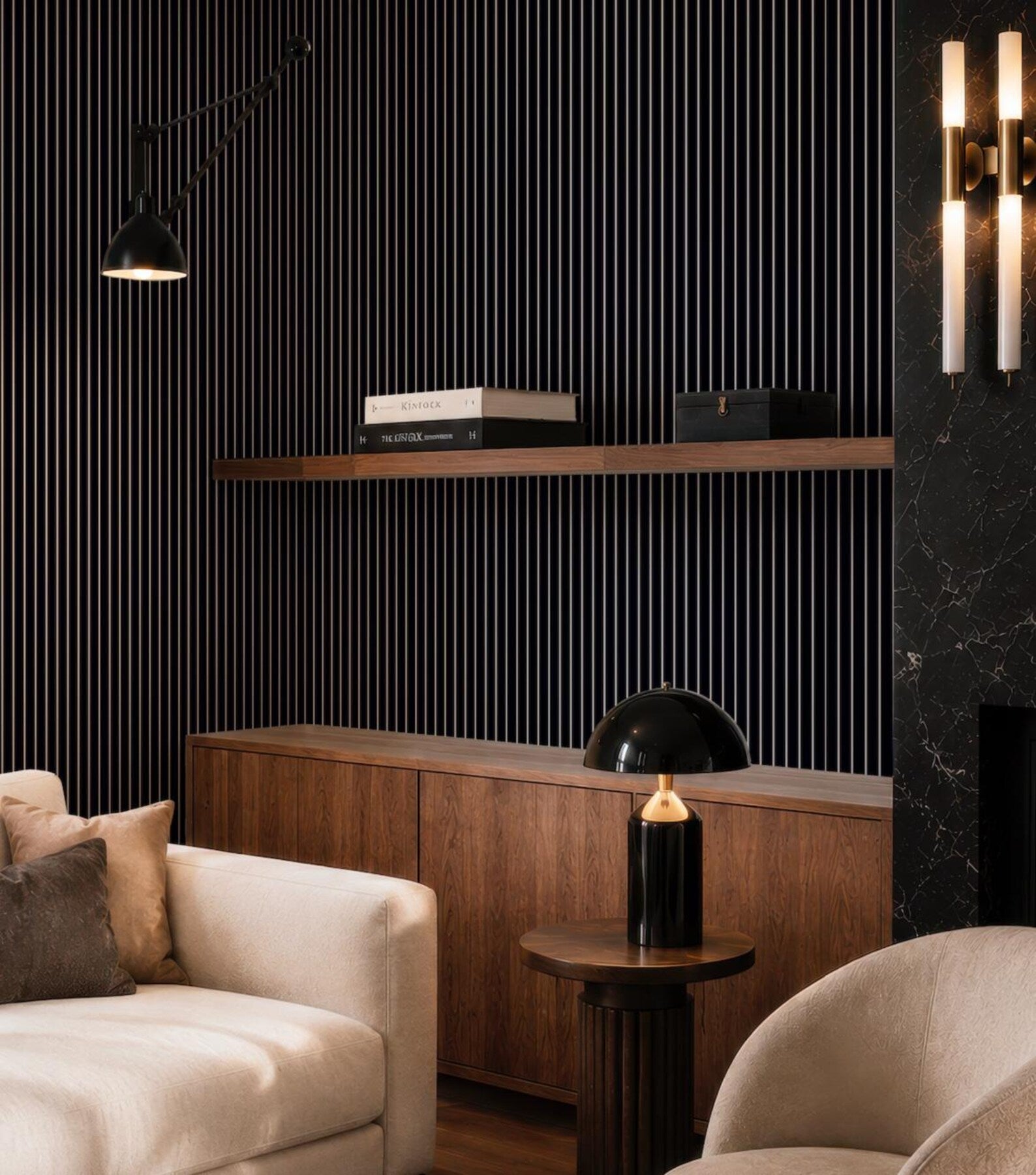 a modern living room with a black and white striped accent wall, a wooden cabinet, a white sofa, and a round wooden side table with a black lamp.