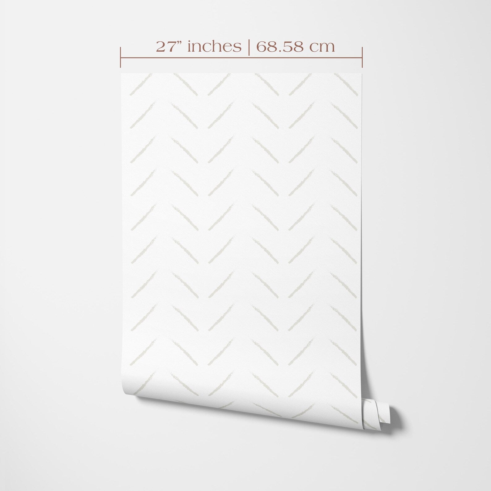 a white wall with a rolled-up patterned wallpaper or paper displayed on it.