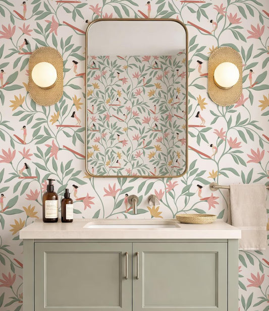 a bathroom with a white sink, a mirror, and a light fixture. The walls are decorated with a floral pattern, and there are two light fixtures on either side of the mirror. The bathroom appears to be well-maintained and clean.