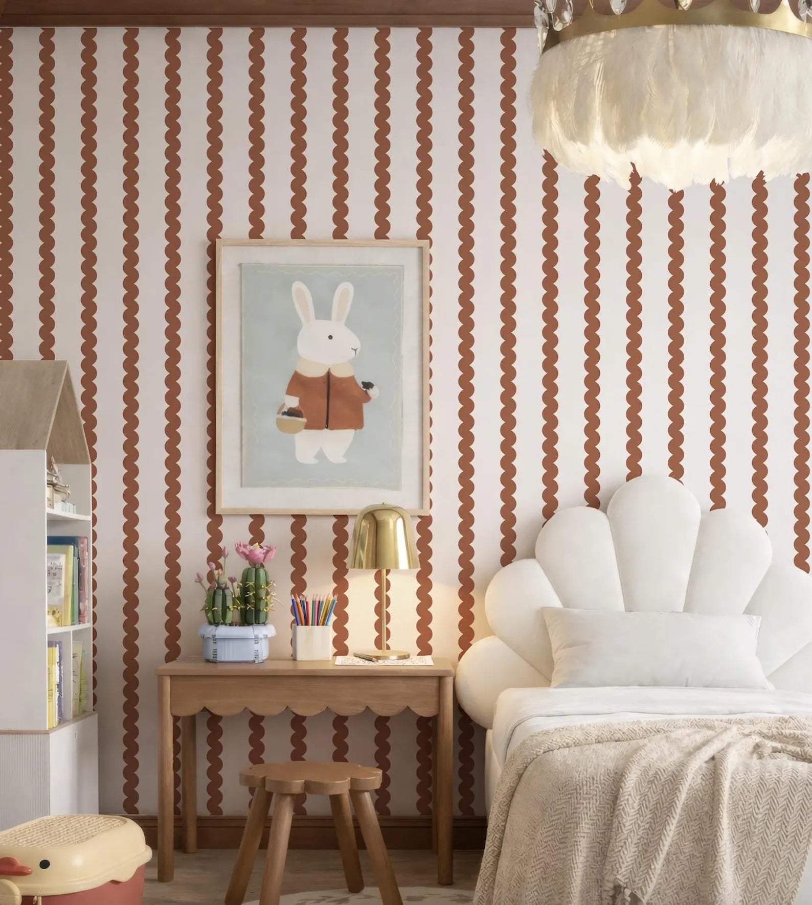 a cozy and charming bedroom with a white bed, a wooden desk, and a framed picture of a rabbit on the wall. The room has a warm and inviting atmosphere, with a chandelier hanging from the ceiling and a plush white bedding set.