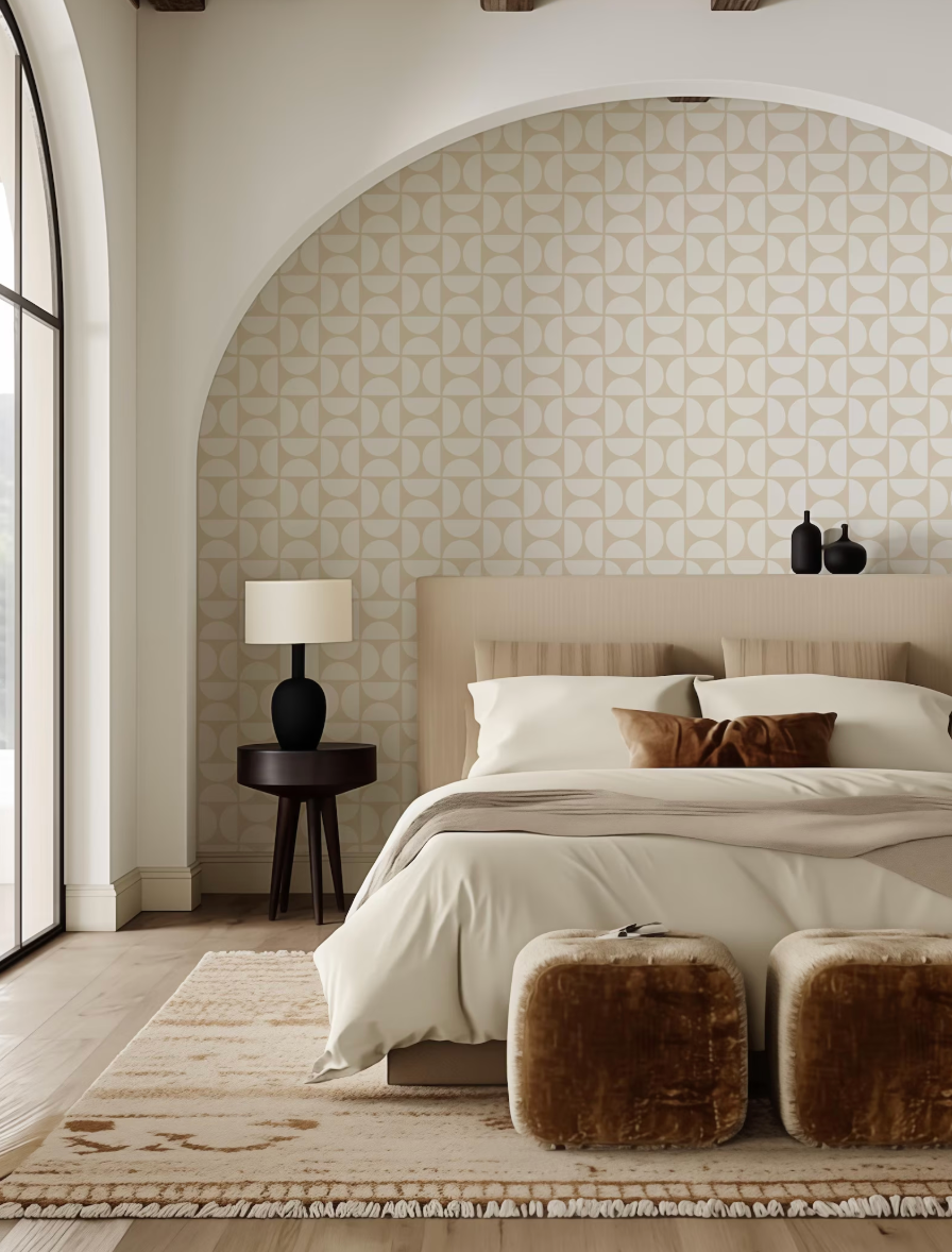 a modern bedroom with a large bed, a wooden nightstand, and a patterned wallpaper. The room has a neutral color scheme with beige and brown tones, creating a warm and inviting atmosphere.