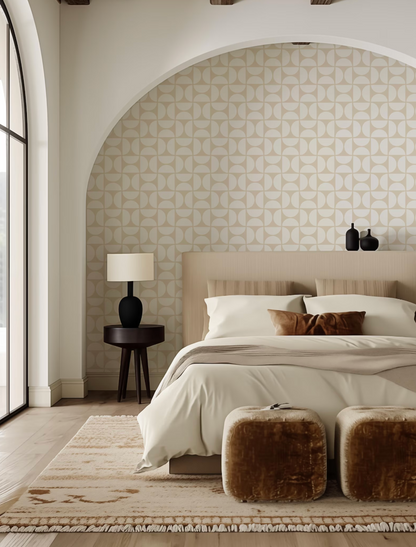 a modern bedroom with a large bed, a wooden nightstand, and a patterned wallpaper. The room has a neutral color scheme with beige and brown tones, creating a warm and inviting atmosphere.
