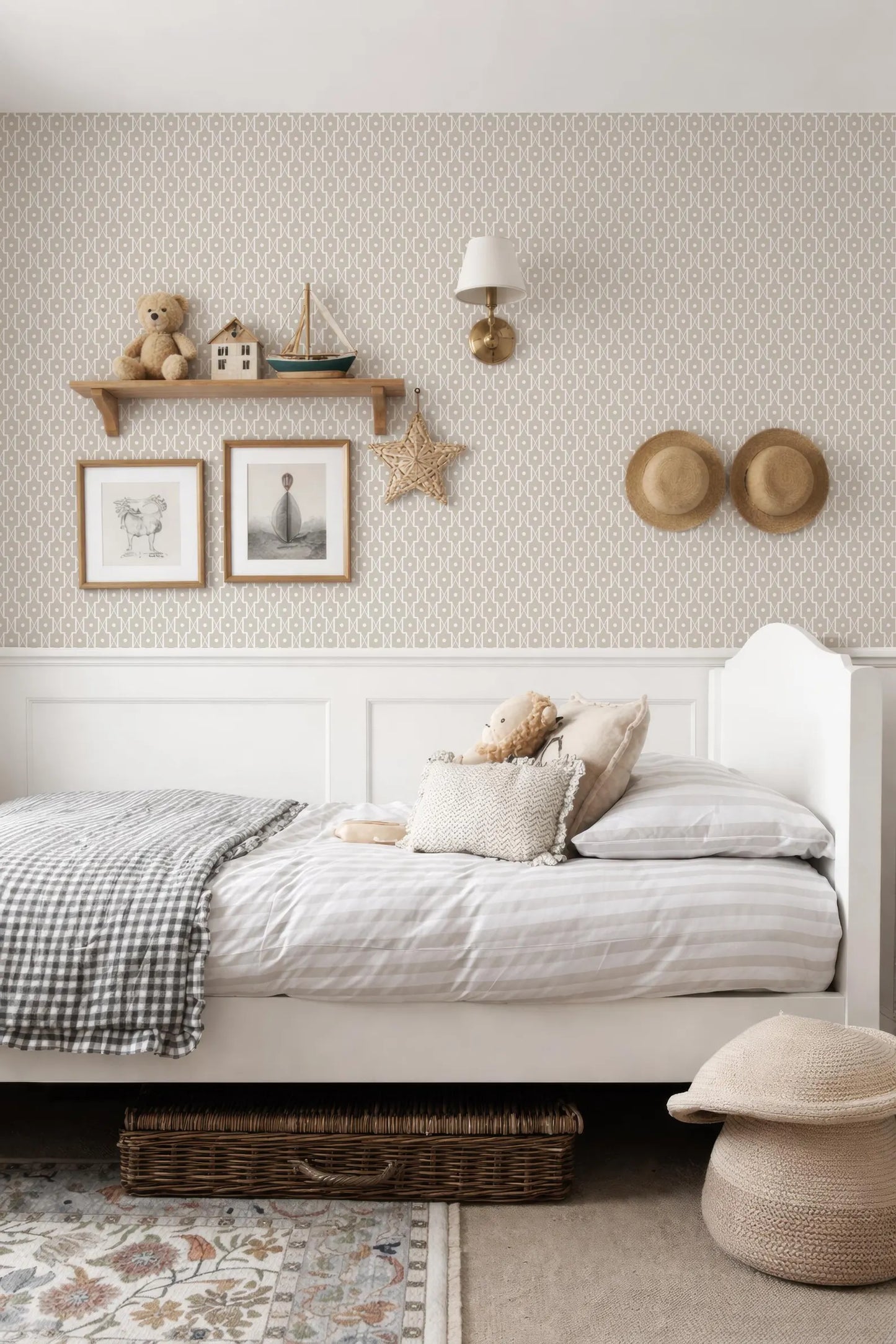 a cozy and well-decorated bedroom with a white bed, a shelf with toys, and a patterned wallpaper.