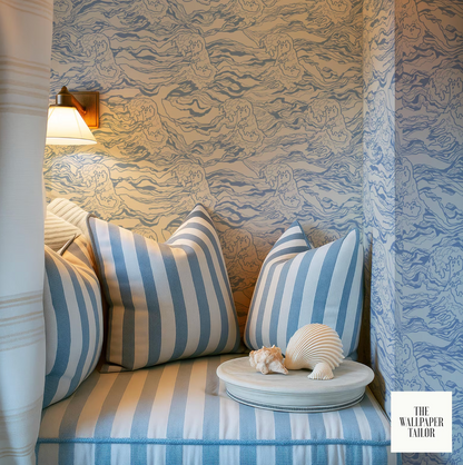 a cozy nook with a striped bench, a decorative seashell, and a wallpapered wall with a wave pattern.