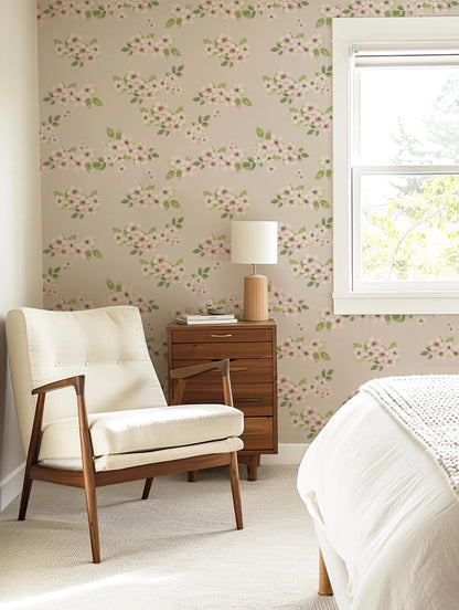 a cozy bedroom with a floral wallpaper, a white armchair, a wooden side table with a lamp, and a window with white blinds.