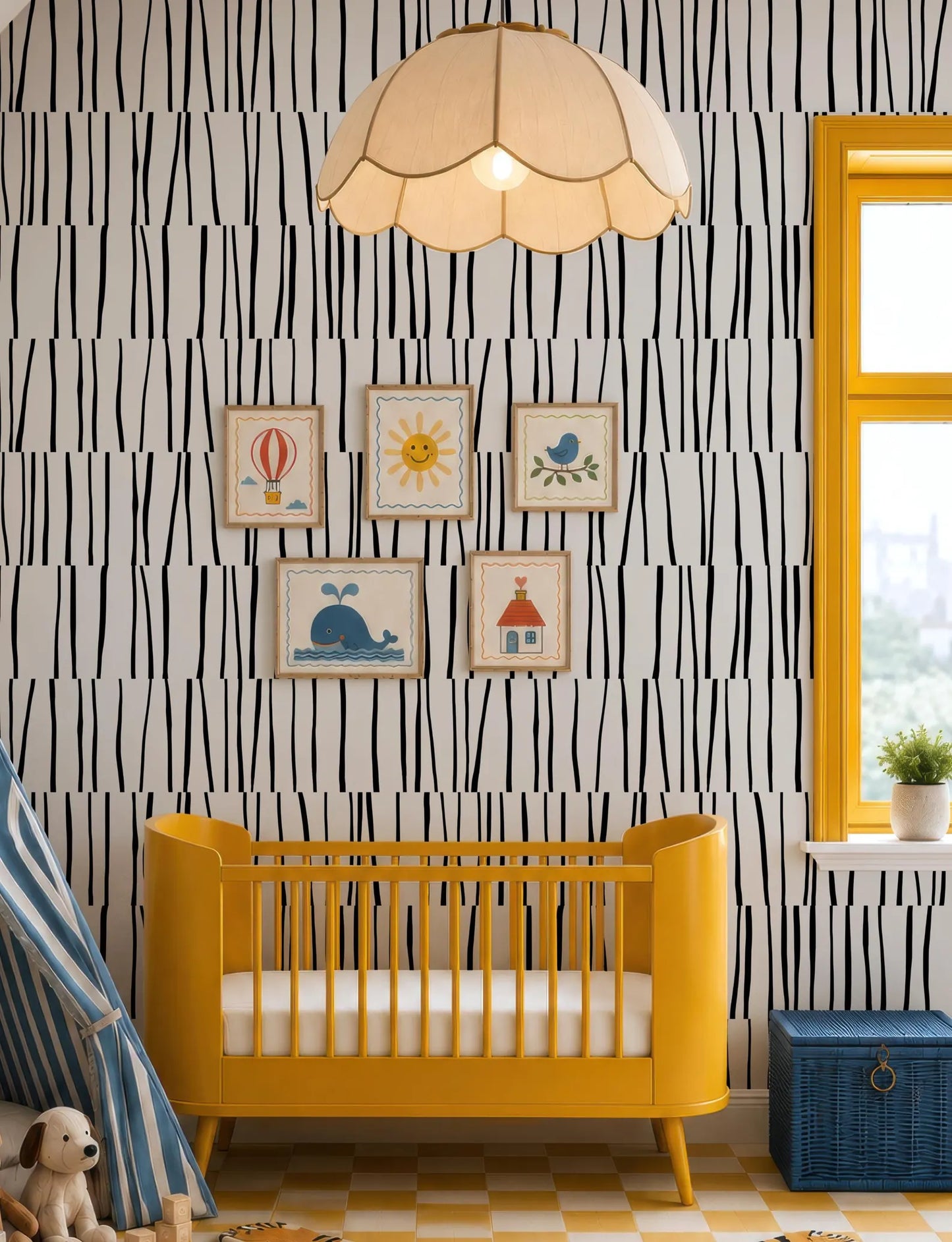 A yellow crib sits in a room with a black and white striped wallpaper, a hanging lamp, and a window with a view of trees outside.
