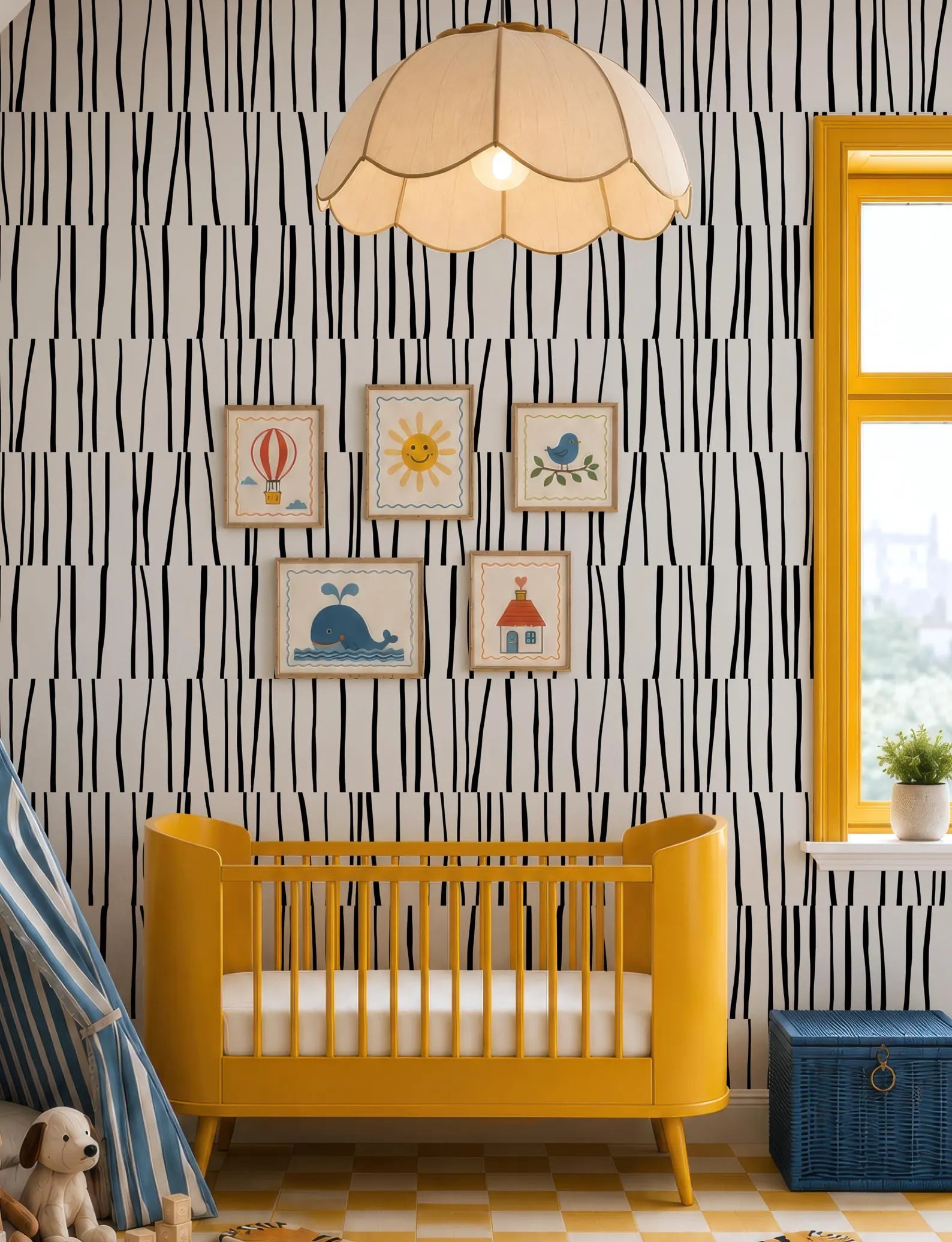 A yellow crib sits in a room with a black and white striped wallpaper, a hanging lamp, and a window with a view of trees outside.